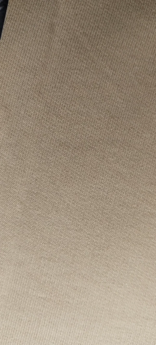 beige t-shirt closeup view